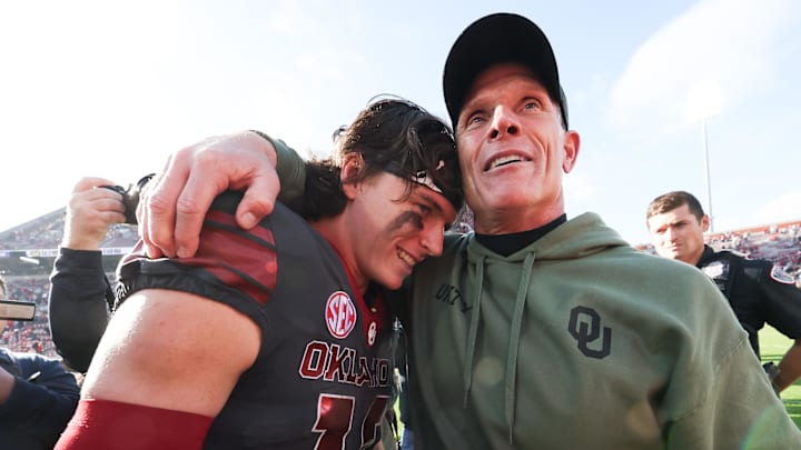 Oklahoma coach Brent Venables embraces Sooners quarterback John Mateer after OU beat Missouri. Oklahoma coach Brent Venables embraces Sooners quarterback John Mateer after OU beat Missouri.