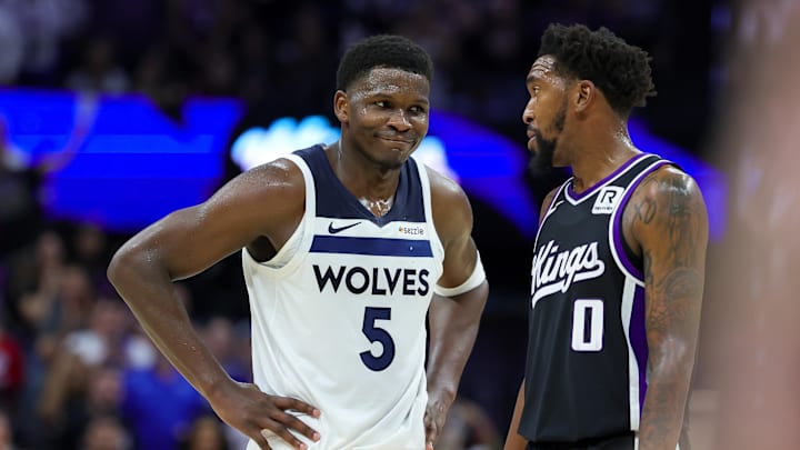 Oct 24, 2024; Sacramento, California, USA; Minnesota Timberwolves guard Anthony Edwards (5) talks with Sacramento Kings guard Malik Monk (0) during the fourth quarter at Golden 1 Center. Mandatory Credit: Sergio Estrada-Imagn Images