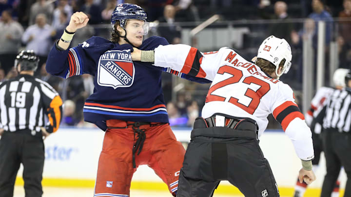 Apr 3, 2024; New York, New York, USA; New York Rangers center Matt Rempe (73) and New Jersey Devils