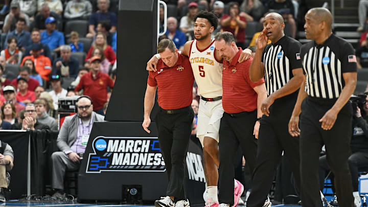 Mar 20, 2026; St. Louis, MO, USA; Iowa State Cyclones forward Joshua Jefferson (5) is helped off of the court after suffering an apparent injury to his left leg while shooting a layup against Tennessee State Tigers forward Jalen Pitre (not pictured) during the first half of a first round game of the men's 2026 NCAA Tournament at Enterprise Center. Mandatory Credit: Jeff Le-Imagn Images Mar 20, 2026; St. Louis, MO, USA; Iowa State Cyclones forward Joshua Jefferson (5) is helped off of the court after suffering an apparent injury to his left leg while shooting a layup against Tennessee State Tigers forward Jalen Pitre (not pictured) during the first half of a first round game of the men's 2026 NCAA Tournament at Enterprise Center. Mandatory Credit: Jeff Le-Imagn Images