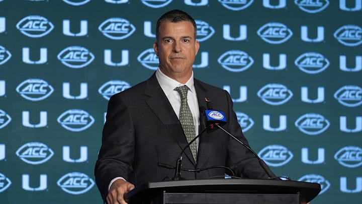 Jul 24, 2024; Charlotte, NC, USA;  Miami Hurricanes head coach Mario Cristobal speaks to the media during the ACC Kickoff at Hilton Charlotte Uptown. Mandatory Credit: Jim Dedmon-USA TODAY Sports
