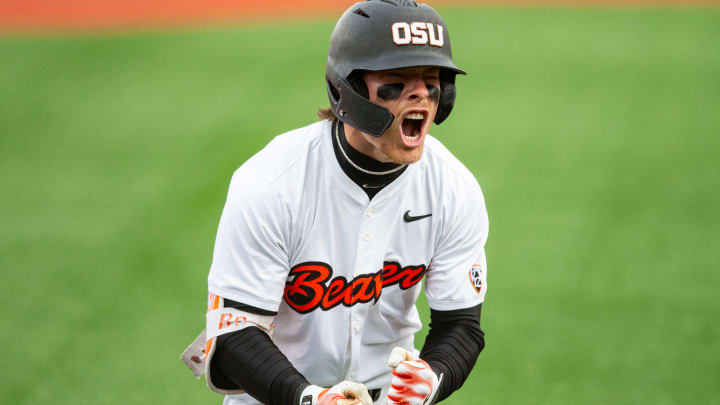 Oregon State's Travis Bazzana (37) celebrates after hitting the team's second solo home run during an NCAA college baseball game against Oregon at Goss Stadium on Friday, April 26, 2024, in Corvallis, Ore.