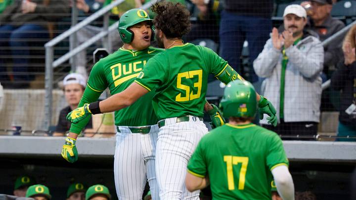 Oregon outfielder Angel Laya, center, and Oregon infielder Naulivou Lauaki Jr., left, celebrate a home run by Laya as the Oregon Ducks host the Oregon State Beavers on March 3, 2026, at PK Park in Eugene, Oregon. Oregon outfielder Angel Laya, center, and Oregon infielder Naulivou Lauaki Jr., left, celebrate a home run by Laya as the Oregon Ducks host the Oregon State Beavers on March 3, 2026, at PK Park in Eugene, Oregon.