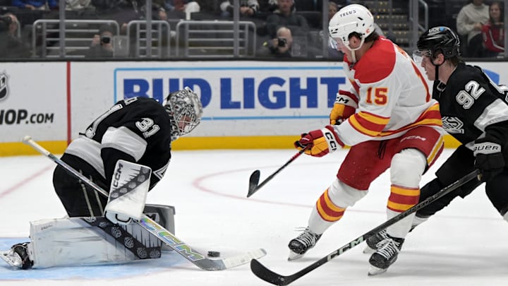 Apr 17, 2025; Los Angeles, California, USA;  Los Angeles Kings goaltender David Rittich (31) makes a shop off a shot by Calgary Flames left wing Dryden Hunt (15) in the third period at Crypto.com Arena. Mandatory Credit: Jayne Kamin-Oncea-Imagn Images