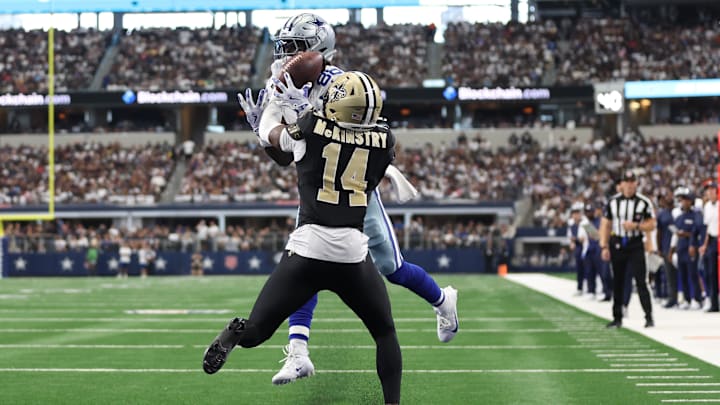 Sep 15, 2024; Arlington, Texas, USA; Dallas Cowboys wide receiver CeeDee Lamb (88) cannot catch a pass while defended by New Orleans Saints cornerback Kool-Aid McKinstry (14) at AT&T Stadium. Mandatory Credit: Tim Heitman-Imagn Images