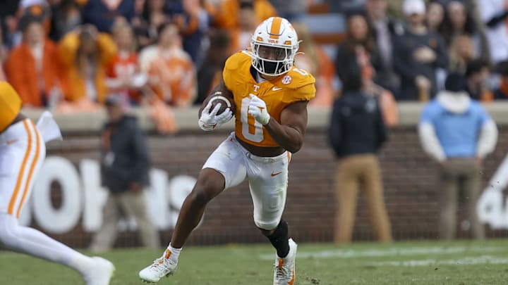 Nov 25, 2023; Knoxville, Tennessee, USA; Tennessee Volunteers running back Jaylen Wright (0) runs the ball against the Vanderbilt Commodores during the first half at Neyland Stadium. Mandatory Credit: Randy Sartin-USA TODAY Sports Nov 25, 2023; Knoxville, Tennessee, USA; Tennessee Volunteers running back Jaylen Wright (0) runs the ball against the Vanderbilt Commodores during the first half at Neyland Stadium. Mandatory Credit: Randy Sartin-USA TODAY Sports