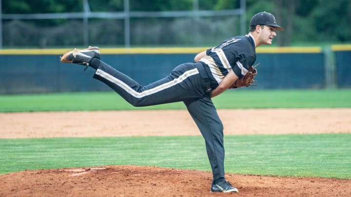 Providence's Michael Forret (11) pitches during their game at Roberson on May 27, 2022. The Providence Panthers defeated the Roberson Rams 3-0. Providence's Michael Forret (11) pitches during their game at Roberson on May 27, 2022. The Providence Panthers defeated the Roberson Rams 3-0.