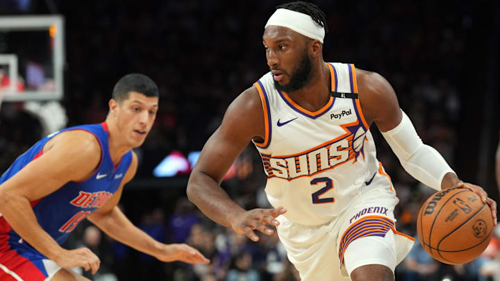 Oct 11, 2024; Phoenix, Arizona, USA; Phoenix Suns forward Josh Okogie (2) dribbles by Detroit Pistons guard Dereon Seabron (18) during the first half at Footprint Center. Mandatory Credit: Joe Camporeale-Imagn Images