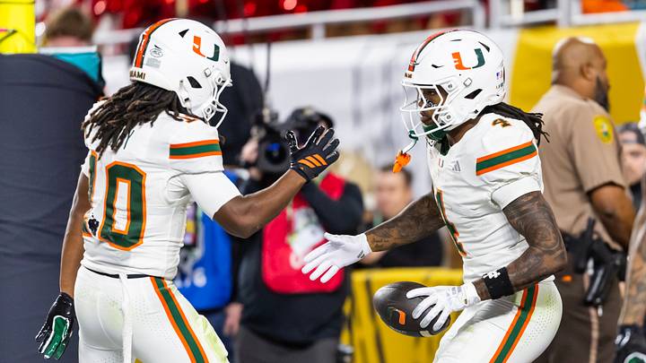 Jan 19, 2026; Miami Gardens, FL, USA; Miami Hurricanes running back Mark Fletcher Jr. (4) celebrates a touchdown with wide receiver Malachi Toney (10) against the Indiana Hoosiers during the College Football Playoff National Championship game at Hard Rock Stadium. Mandatory Credit: Mark J. Rebilas-Imagn Images