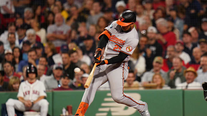 Sep 11, 2024; Boston, Massachusetts, USA; Baltimore Orioles designated hitter Anthony Santander (25) hits a home run against the Boston Red Sox in the eighth inning at Fenway Park.