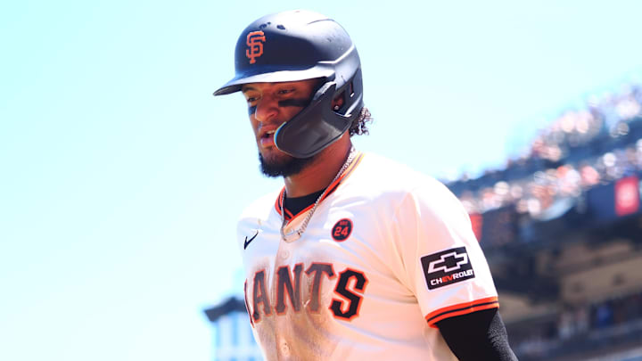 Jun 30, 2024; San Francisco, California, USA; San Francisco Giants left fielder Luis Matos (29) jogs to the dugout after scoring a run against the Los Angeles Dodgers during the third inning at Oracle Park