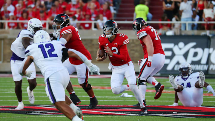 Sep 16, 2023; Lubbock, Texas, USA;  Texas Tech Red Raiders quarterback Tyler Shough (12) runs the ball against Tarleton State Texans defensive back Devin Sterling (12) in the first half at Jones AT&T Stadium and Cody Campbell Field. Mandatory Credit: Michael C. Johnson-Imagn Images
