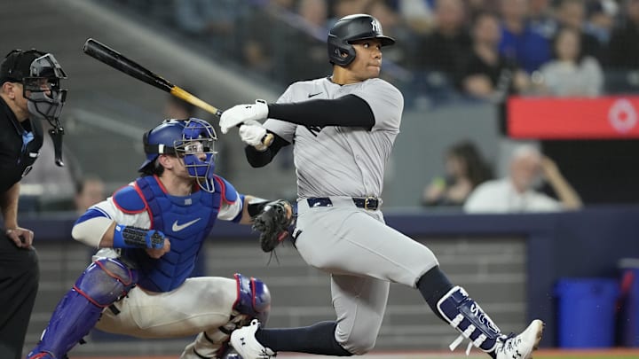 Apr 16, 2024; Toronto, Ontario, CAN; New York Yankees right fielder Juan Soto (22) hits a single against the Toronto Blue Jays during the sixth inning at Rogers Centre. Apr 16, 2024; Toronto, Ontario, CAN; New York Yankees right fielder Juan Soto (22) hits a single against the Toronto Blue Jays during the sixth inning at Rogers Centre.