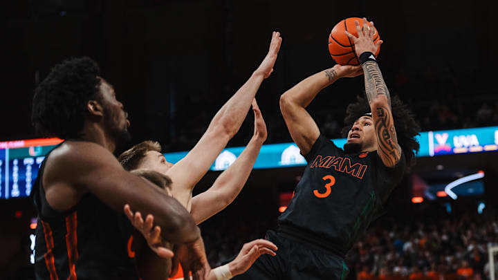 Feb 21, 2026; Charlottesville, Virginia, USA; Miami (FL) Hurricanes guard Tre Donaldson (3) shoots the ball while Virginia Cavaliers forward Thijs de Ridder (28) defends during the first half at John Paul Jones Arena. Mandatory Credit: Emily Faith Morgan-Imagn Images