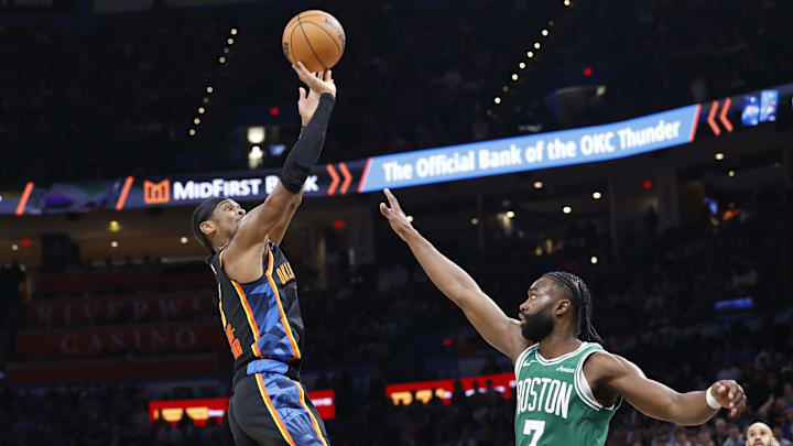 Jan 5, 2025; Oklahoma City, Oklahoma, USA; Oklahoma City Thunder guard Shai Gilgeous-Alexander (2) shoots the ball over Boston Celtics guard Jaylen Brown (7) during the fourth quarter at Paycom Center.