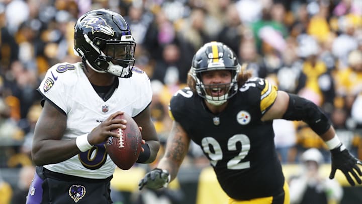 Baltimore Ravens quarterback Lamar Jackson (8) scrambles with the ball against the Pittsburgh Steelers during the fourth quarter at Acrisure Stadium. 