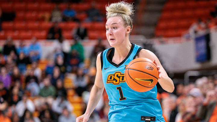Nov 9, 2025; Stillwater, Oklahoma, USA; Oklahoma State Cowgirls guard Amari Whiting (1) drives to the basket during the first half against the Oral Roberts Golden Eagles at Gallagher-Iba Arena. Mandatory Credit: William Purnell-Imagn Images