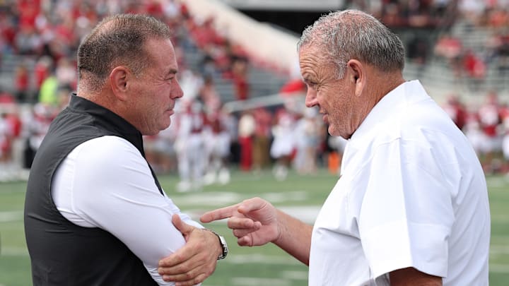 Sep 6, 2025; Little Rock, Arkansas, USA; Arkansas State Red Wolves head coach Butch Jones talks to Arkansas Razorbacks head coach Sam Pittman prior to the game at War Memorial Stadium. Mandatory Credit: Nelson Chenault-Imagn Images
