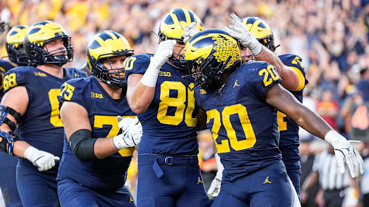 running back Kalel Mullings (20) celebrates a touchdown against USC with teammates during the second half at Michigan Stadium in Ann Arbor on Saturday, Sept. 21, 2024.