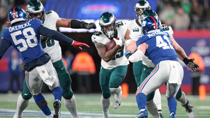 Jan 7, 2024; East Rutherford, New Jersey, USA; Philadelphia Eagles running back Rashaad Penny (23) carries the ball as New York Giants linebacker Micah McFadden (41) and linebacker Bobby Okereke (58) pursue during the second half at MetLife Stadium. Jan 7, 2024; East Rutherford, New Jersey, USA; Philadelphia Eagles running back Rashaad Penny (23) carries the ball as New York Giants linebacker Micah McFadden (41) and linebacker Bobby Okereke (58) pursue during the second half at MetLife Stadium.