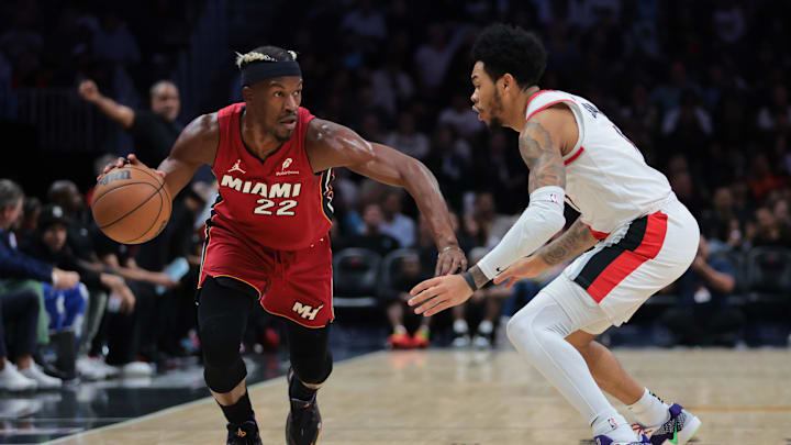 Jan 21, 2025; Miami, Florida, USA; Miami Heat forward Jimmy Butler (22) drives to the basket past Portland Trail Blazers guard Anfernee Simons (1) during the first quarter at Kaseya Center. Mandatory Credit: Sam Navarro-Imagn Images Jan 21, 2025; Miami, Florida, USA; Miami Heat forward Jimmy Butler (22) drives to the basket past Portland Trail Blazers guard Anfernee Simons (1) during the first quarter at Kaseya Center. Mandatory Credit: Sam Navarro-Imagn Images