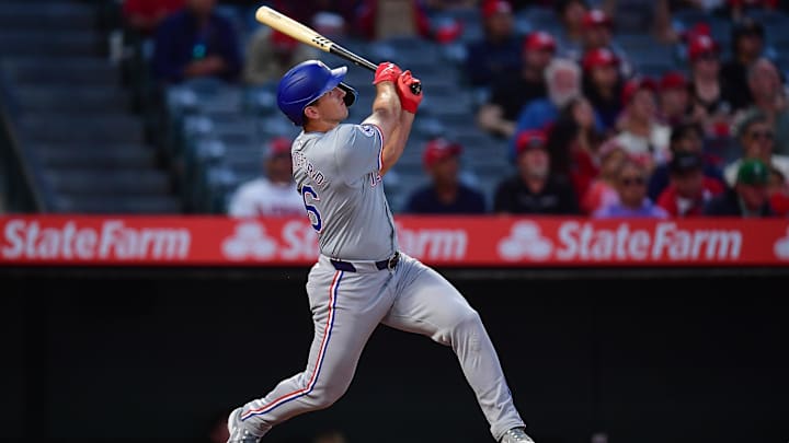 Sep 27, 2024; Anaheim, California, USA; Texas Rangers center fielder Wyatt Langford (36) hits a two run home run against the Los Angeles Angels during the first inning at Angel Stadium. 
