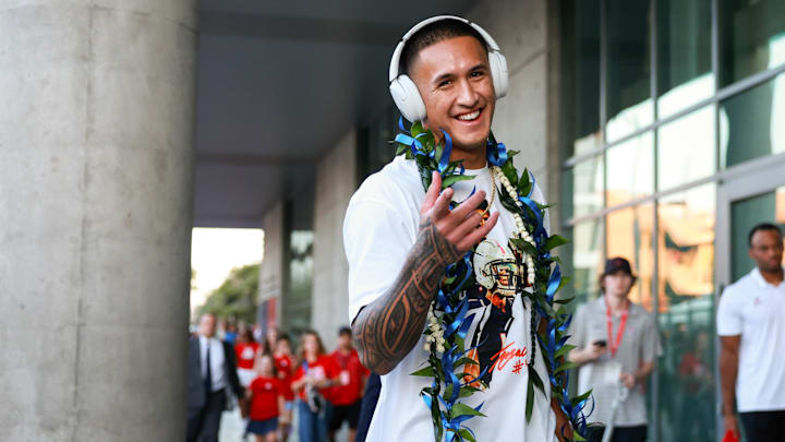 Arizona Wildcats wide receiver Tetairoa McMillan walks down the Wildcat Walk before the game against Texas Tech.