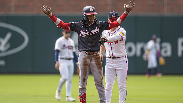 Sep 24, 2025; Cumberland, Georgia, USA; Washington Nationals shortstop CJ Abrams (5) reacts after hitting a double against the Atlanta Braves during the first inning at Truist Park. Mandatory Credit: Dale Zanine-Imagn Images
