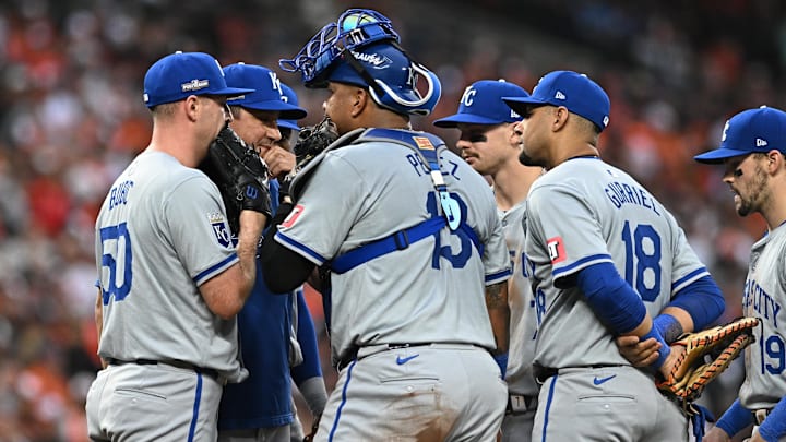 Oct 1, 2024; Baltimore, Maryland, USA; Kansas City Royals pitcher Kris Bubic (50) and Kansas City Royals catcher Salvador Perez (13) meet with pitching coach Brian Sweeney (85) in the eighth inning against the Baltimore Orioles in game one of the Wild Card round for the 2024 MLB Playoffs at Oriole Park at Camden Yards. Mandatory Credit: Tommy Gilligan-Imagn Images