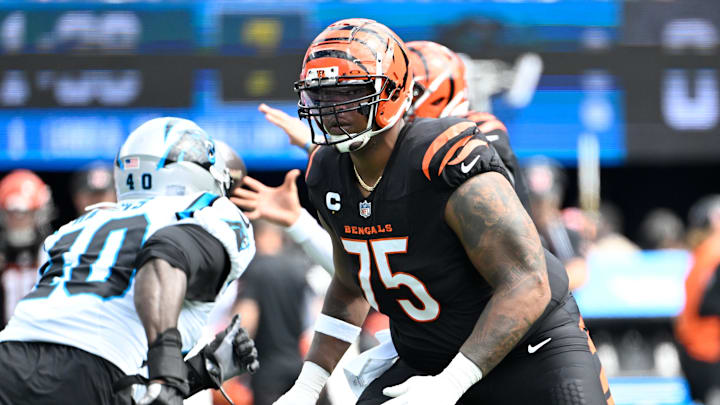 Sep 29, 2024; Charlotte, North Carolina, USA; Cincinnati Bengals offensive tackle Orlando Brown Jr. (75) blocks as Carolina Panthers linebacker Charles Harris (40) rushes in the first quarter at Bank of America Stadium. Mandatory Credit: Bob Donnan-Imagn Images Sep 29, 2024; Charlotte, North Carolina, USA; Cincinnati Bengals offensive tackle Orlando Brown Jr. (75) blocks as Carolina Panthers linebacker Charles Harris (40) rushes in the first quarter at Bank of America Stadium. Mandatory Credit: Bob Donnan-Imagn Images
