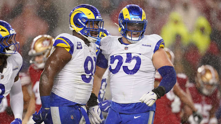 Dec 12, 2024; Santa Clara, California, USA; Los Angeles Rams defensive tackle Kobie Turner (91) is congratulated by defensive tackle Braden Fiske (55) after recording a sack against the San Francisco 49ers in the second quarter at Levi's Stadium. Mandatory Credit: Cary Edmondson-Imagn Images