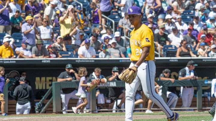 Jun 22, 2025; Omaha, Neb, USA;  LSU Tigers starting pitcher Anthony Eyanson (24) walks to the dugout against the Coastal Carolina Chanticleers after the sixth inning at Charles Schwab Field. Mandatory Credit: Steven Branscombe-Imagn Images