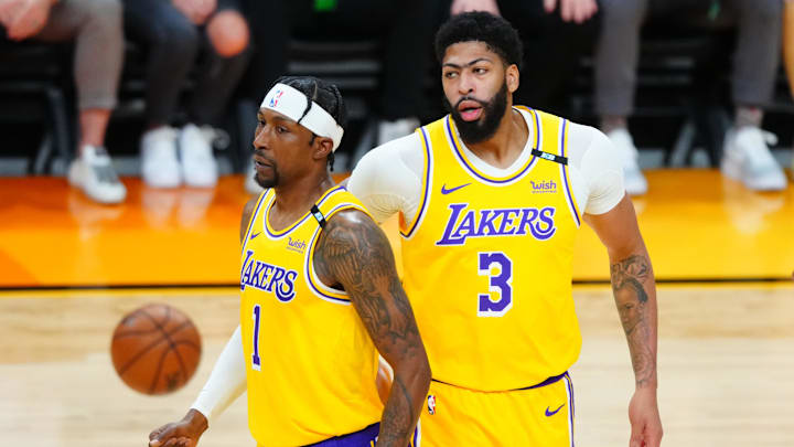May 25, 2021; Phoenix, Arizona, USA; Los Angeles Lakers guard Kentavious Caldwell-Pope (1) and forward Anthony Davis (3) against the Phoenix Suns during game two of the first round of the 2021 NBA Playoffs at Phoenix Suns Arena. Mandatory Credit: Mark J. Rebilas-Imagn Images