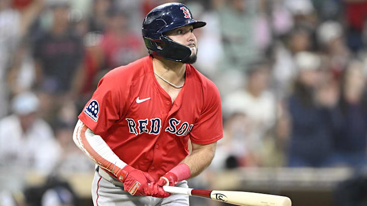 Wilyer Abreu of Boston Red Sox watches ball after hitting it.