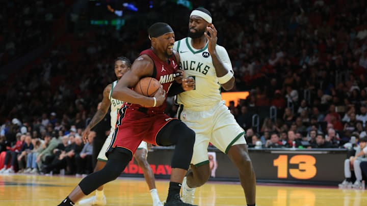 Nov 26, 2024; Miami, Florida, USA; Miami Heat center Bam Adebayo (13) drives to the basket against Milwaukee Bucks forward Bobby Portis (9) during the second quarter at Kaseya Center. Mandatory Credit: Sam Navarro-Imagn Images Nov 26, 2024; Miami, Florida, USA; Miami Heat center Bam Adebayo (13) drives to the basket against Milwaukee Bucks forward Bobby Portis (9) during the second quarter at Kaseya Center. Mandatory Credit: Sam Navarro-Imagn Images