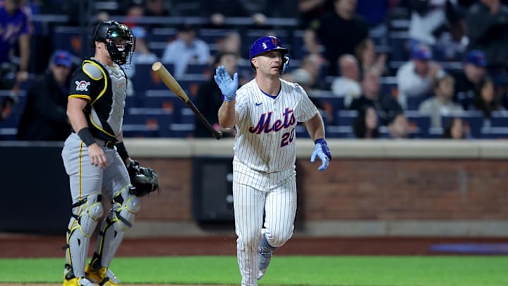 May 12, 2025; New York City, New York, USA; New York Mets first baseman Pete Alonso (20) tosses his bat after hitting a ninth inning walkoff RBI sacrifice fly against the Pittsburgh Pirates at Citi Field. Mandatory Credit: Brad Penner-Imagn Images