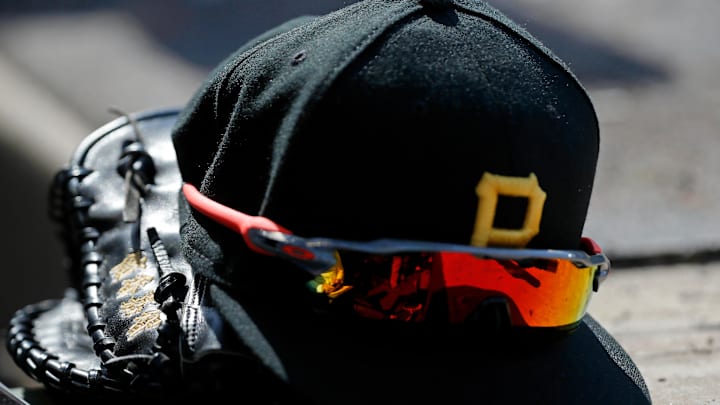 Apr 23, 2022; Chicago, Illinois, USA; A detail view of the glove, hat, and sunglasses of Pittsburgh