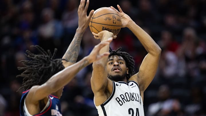 Feb 3, 2024; Philadelphia, Pennsylvania, USA; Brooklyn Nets guard Cam Thomas (24) shoots past Philadelphia 76ers guard Terquavion Smith (23) during the fourth quarter at Wells Fargo Center. Mandatory Credit: Bill Streicher-Imagn Images