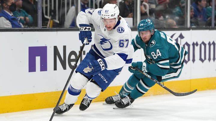 Jan 3, 2026; San Jose, California, USA; Tampa Bay Lightning defenseman Declan Carlile (67) skates with the puck against San Jose Sharks left wing Pavol Regenda (84) during the second period at SAP Center at San Jose. Mandatory Credit: Darren Yamashita-Imagn Images Jan 3, 2026; San Jose, California, USA; Tampa Bay Lightning defenseman Declan Carlile (67) skates with the puck against San Jose Sharks left wing Pavol Regenda (84) during the second period at SAP Center at San Jose. Mandatory Credit: Darren Yamashita-Imagn Images