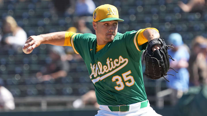 Mar 6, 2026; Mesa, Arizona, USA; Athletics pitcher J.T. Ginn (35) throws against the Colorado Rockies in the first inning at Hohokam Stadium. Mandatory Credit: Rick Scuteri-Imagn Images