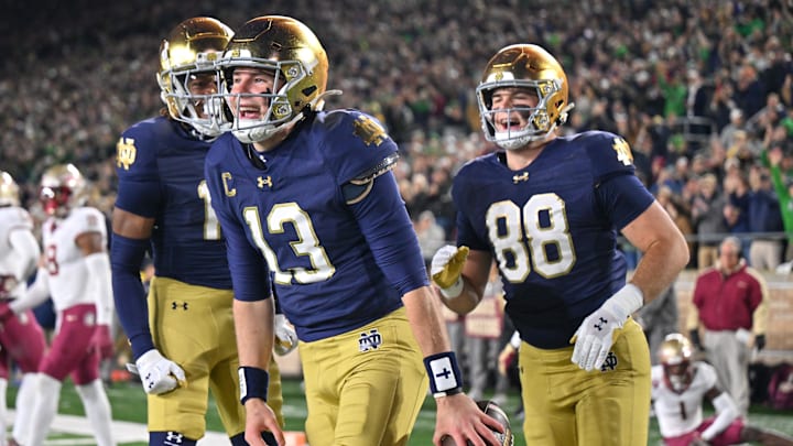 Nov 9, 2024; South Bend, Indiana, USA; Notre Dame Fighting Irish quarterback Riley Leonard (13) celebrates after a touchdown against the Florida State Seminoles during the first quarter at Notre Dame Stadium. 