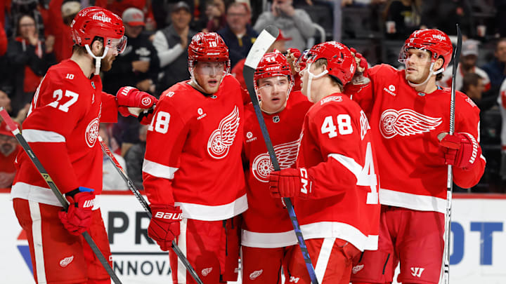 Nov 13, 2025; Detroit, Michigan, USA;  Detroit Red Wings defenseman Axel Sandin-Pellikka (44) receives congratulations from teammates after scoring in the second period against the Anaheim Ducks at Little Caesars Arena. Mandatory Credit: Rick Osentoski-Imagn Images