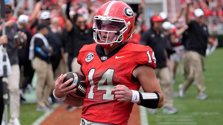 Georgia quarterback Gunner Stockton (14) runs in for another touchdown during the first half of a NCAA college football game against Kentucky in Athens, Ga., on Saturday, October 4, 2025.
