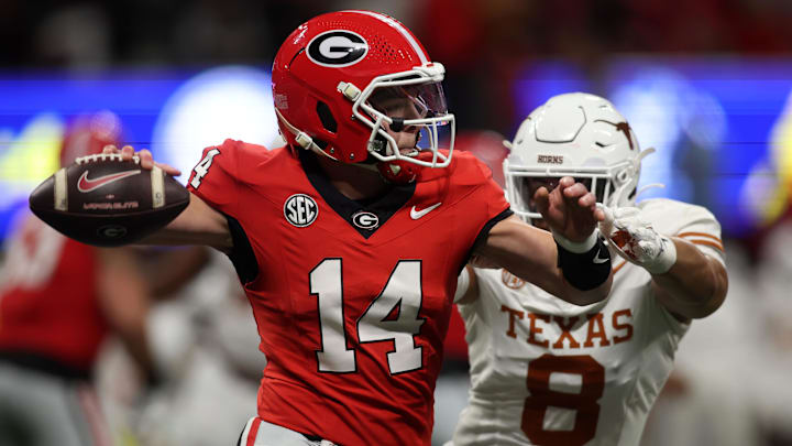 Dec 7, 2024; Atlanta, GA, USA; Georgia Bulldogs quarterback Gunner Stockton (14) drops back to pass against the Texas Longhorns during the second half in the 2024 SEC Championship game at Mercedes-Benz Stadium. Mandatory Credit: Brett Davis-Imagn Images