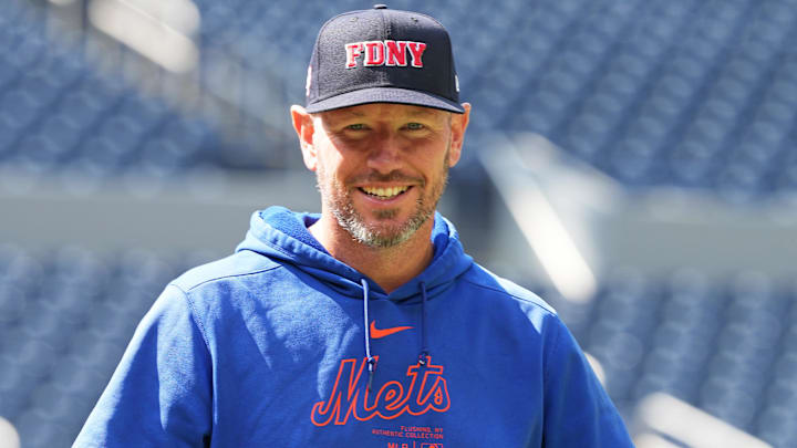 Sep 11, 2024; Toronto, Ontario, CAN; New York Mets pitching coach Jeremy Hefner (65) walks towards the outfield wearing a City of New York Fire Department baseball cap during batting practice before a game against the Toronto Blue Jays at Rogers Centre. Mandatory Credit: Nick Turchiaro-Imagn Images Sep 11, 2024; Toronto, Ontario, CAN; New York Mets pitching coach Jeremy Hefner (65) walks towards the outfield wearing a City of New York Fire Department baseball cap during batting practice before a game against the Toronto Blue Jays at Rogers Centre. Mandatory Credit: Nick Turchiaro-Imagn Images