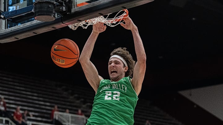 Dec 3, 2024; Stanford, California, USA; Utah Valley Wolverines forward Carter Welling (22) dunks the basketball against the Stanford Cardinal during the second half at Maples Pavilion. Mandatory Credit: Neville E. Guard-Imagn Images Dec 3, 2024; Stanford, California, USA; Utah Valley Wolverines forward Carter Welling (22) dunks the basketball against the Stanford Cardinal during the second half at Maples Pavilion. Mandatory Credit: Neville E. Guard-Imagn Images