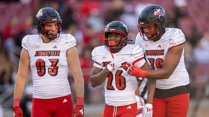Nov 16, 2024; Stanford, California, USA;  Louisville Cardinals running back Duke Watson (26) celebrates after scoring a touchdown against the Stanford Cardinal during the fourth quarter at Stanford Stadium. Mandatory Credit: Bob Kupbens-Imagn Images