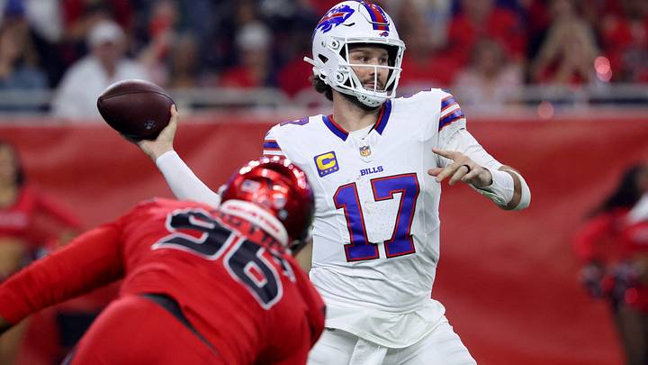 Buffalo Bills quarterback Josh Allen throws a pass against Houston Texans defensive end Denico Autry. Buffalo Bills quarterback Josh Allen throws a pass against Houston Texans defensive end Denico Autry.