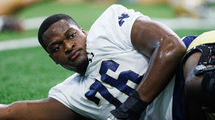 Notre Dame offensive lineman Guerby Lambert warms up during a Notre Dame football practice at Irish Athletic Center on Thursday, Aug. 15, 2024, in South Bend.