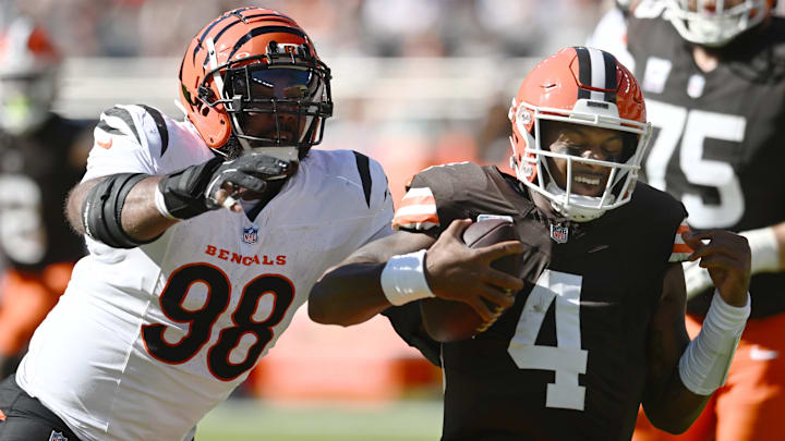 Oct 20, 2024; Cleveland, Ohio, USA; Cincinnati Bengals defensive tackle Sheldon Rankins (98) tackles Cleveland Browns quarterback Deshaun Watson (4) during the first half at Huntington Bank Field. Mandatory Credit: Ken Blaze-Imagn Images